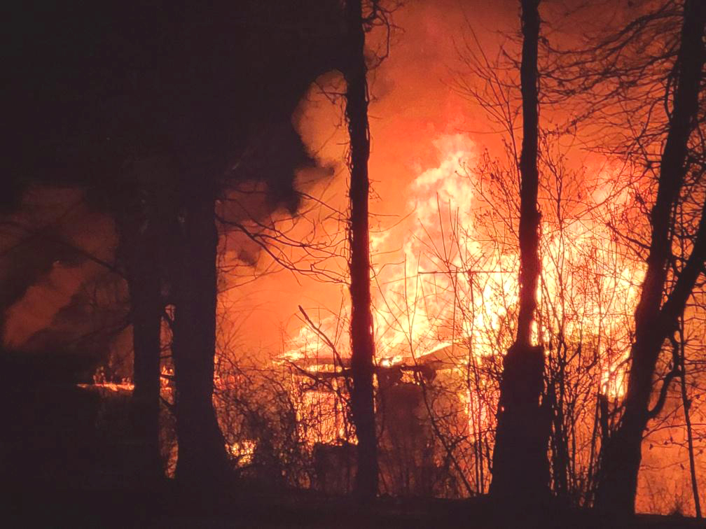 Dog alerts owner to neighboring house fire - The Review